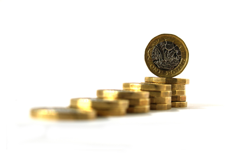 Pounds coins stacked in piles