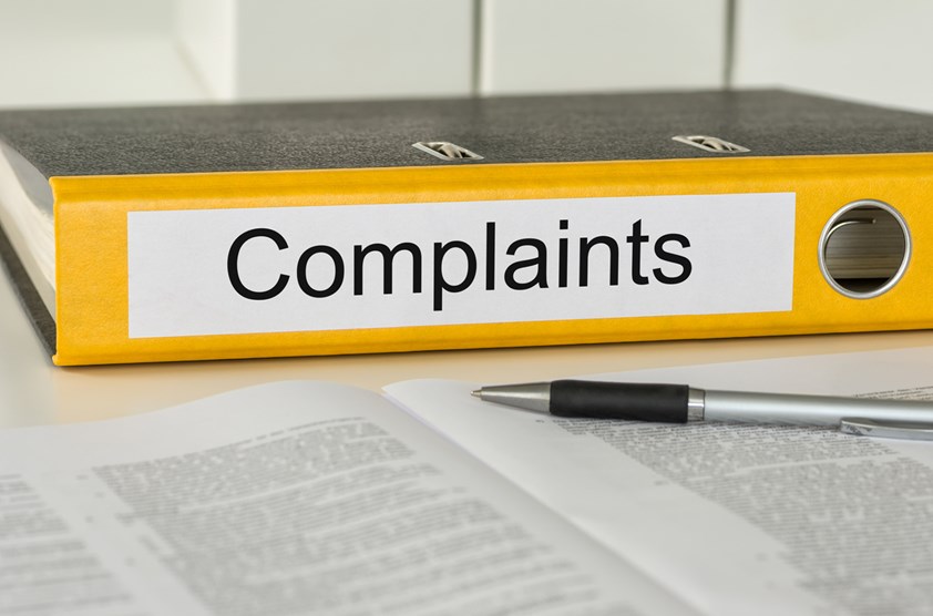 A folder with the words 'Complaints' on it